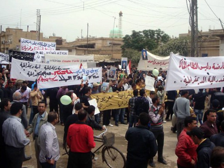 HARSH REPRISALS: Syrian anti-government protesters gather in the city of Qamishli on April 29. Security forces have treated detained protesters harshly, as one 25-year-old recounted to Amnesty International.  (AFP/AFP/Getty Images)