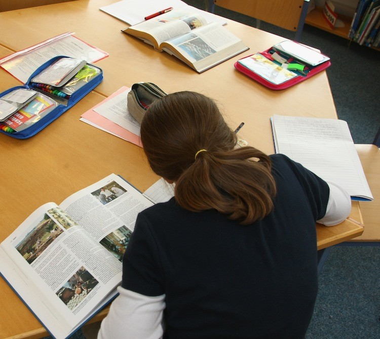 A fourth-grade student works on school work in this file photo. Sens. Tom Harkin (D-Iowa) and Mike Enzi (R-Wyo.) have proposed a revamp of the No Child Left Behind law, allowing states themselves to develop their own systems of accountability.  (Sean Gallup/Getty Images)