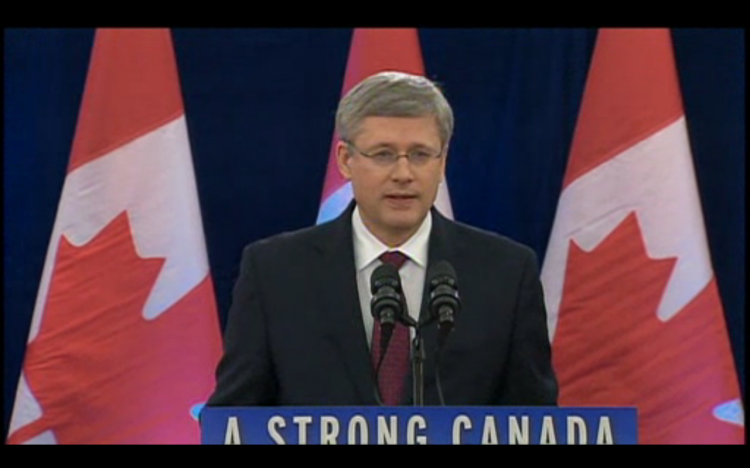 A screenshot from CBC News, taken on Dec. 7, 2012, shows Canadian Prime Minister Stephen Harper announcing that the government would allow Chinese state-owned CNOOC to take over Calgary-based Nexen Inc., while signalling Canada's disapproval of increased takeovers by foreign state-owned enterprises in Canada's oil sands. (Screenshot/CBC News)