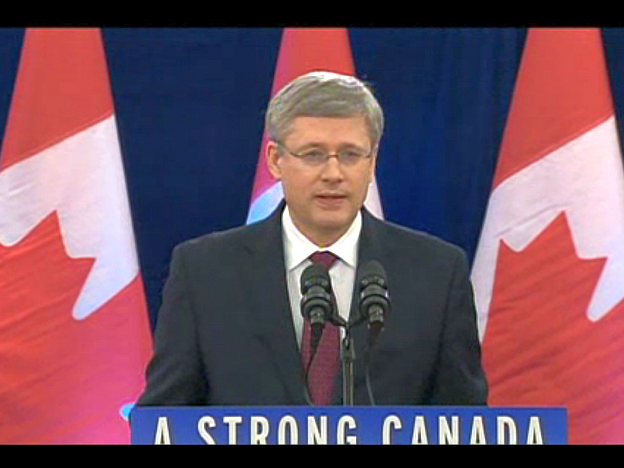 A screenshot from CBC News, taken on Dec. 7, 2012, shows Canadian Prime Minister Stephen Harper announcing that the government would allow Chinese state-owned CNOOC to take over Calgary-based Nexen Inc., while signalling Canada's disapproval of increased takeovers by foreign state-owned enterprises in Canada's oil sands. (Screenshot/CBC News)