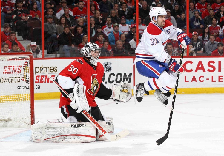 Ottawa goalie Ben Bishop starred in his role as backup to the injured Craig Anderson as Montreal captain Brian Gionta attempts to screen him. (Jana Chytilova/Freestyle Photography/Getty Images)