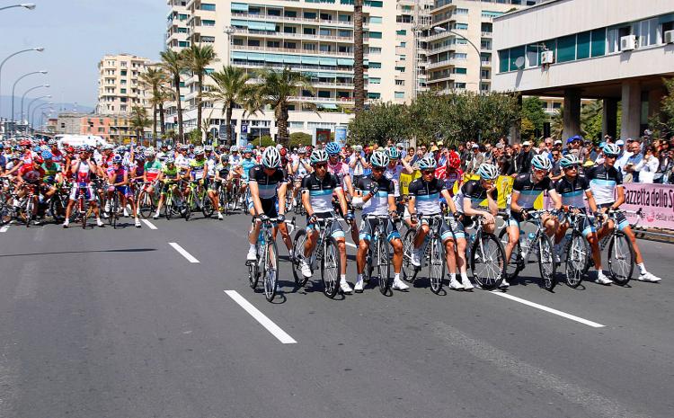 Leopard Trek riders (front) and the pack hold a minute of silence in memory of teammate, Belgian rider Wouter Weylandt and prior to the start of the fourth stage of the 94rd Giro d'Italia. (Luk Benies/AFP/Getty Images)