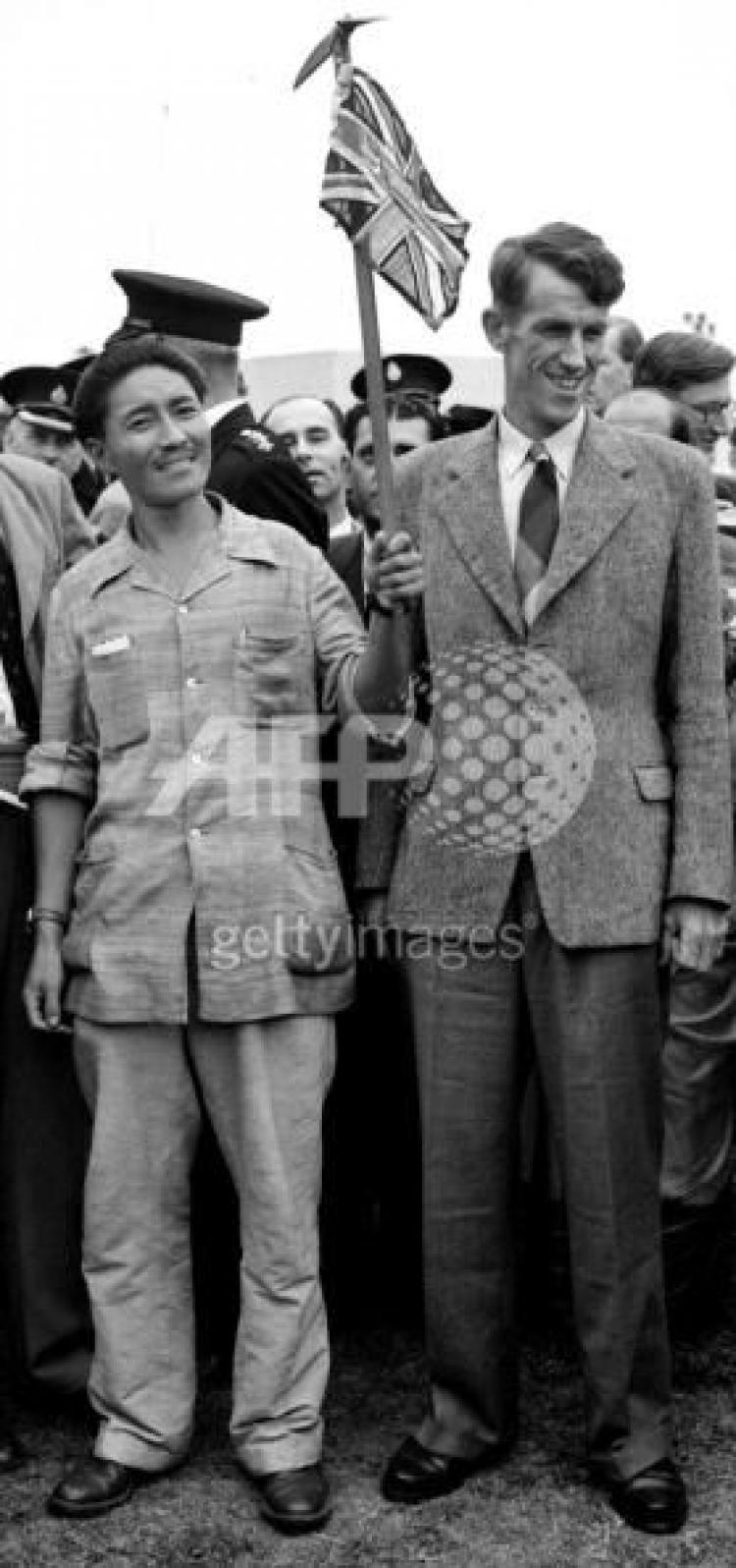 Picture dated 03 July 1953 of Mount Everest conquerors Edmund Hillary (R) and Sherpa Tenzing Norgay (L) at London's Heathrow airport on their return from the successful expedition. (AFP/Getty Images)