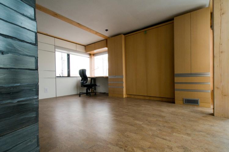 The bedroom and office area of the solar house. The room contains a Murphy bed, which saves space by folding up into a closet when not in use.  (Alberta Solar Decathlon Project)