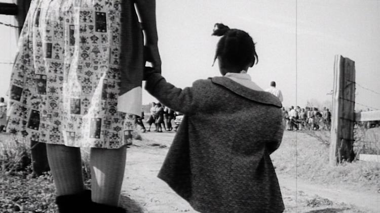 BLOODY SUNDAY: A mother and daughter watch the famous civil rights march from Selma to Montgomery, Alabama in the new documentary 'Soundtrack for a Revolution.' The marchers were attacked by local authorities, yet persevered in their peaceful march. (Courtesy of the National Archives)