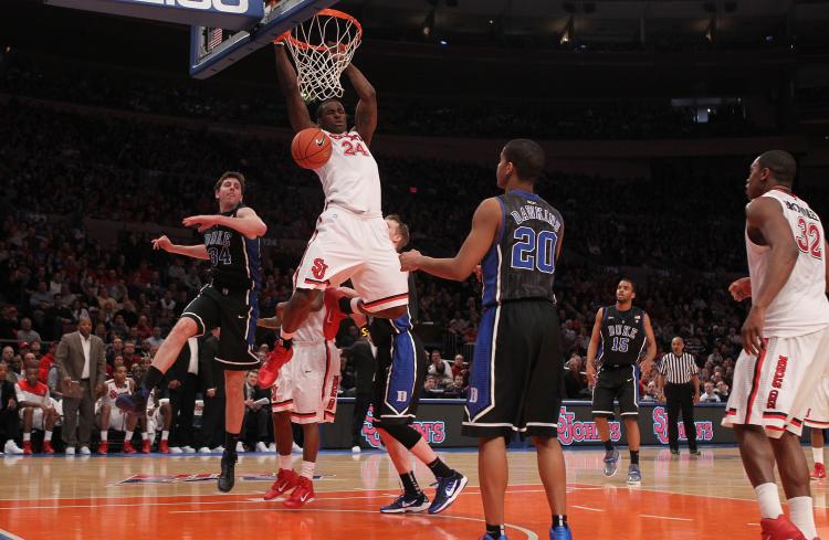 ST. JOHN'S POWER: Red Storm senior forward Justin Burrell slams home a dunk on the defending national champion Duke Blue Devils on Sunday. (Nick Laham/Getty Images)