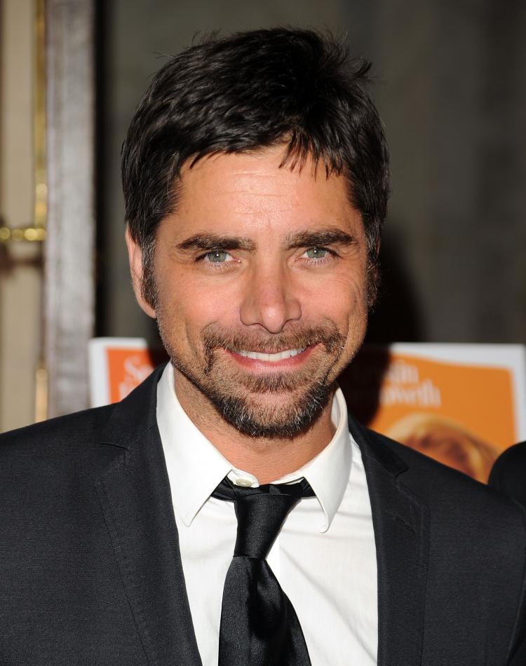 Actor John Stamos has been chosen to play a role in FOX's hit television series Glee next season. If agreed upon, he will play the role of Emma's secret new boyfriend. (Andrew H. Walker/Getty Images)
