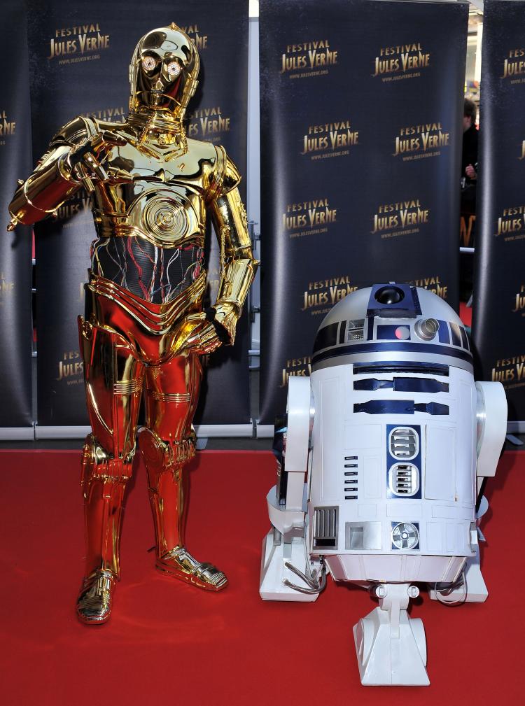 Dynamic Duo: C3PO on the red carpet with his pal R2D2, during the 18th Adventure Film Festival at Le Grand Rex on April 23, in Paris, France at a Tribute to Star Wars V. (Pascal Le Segretain/Getty Images)