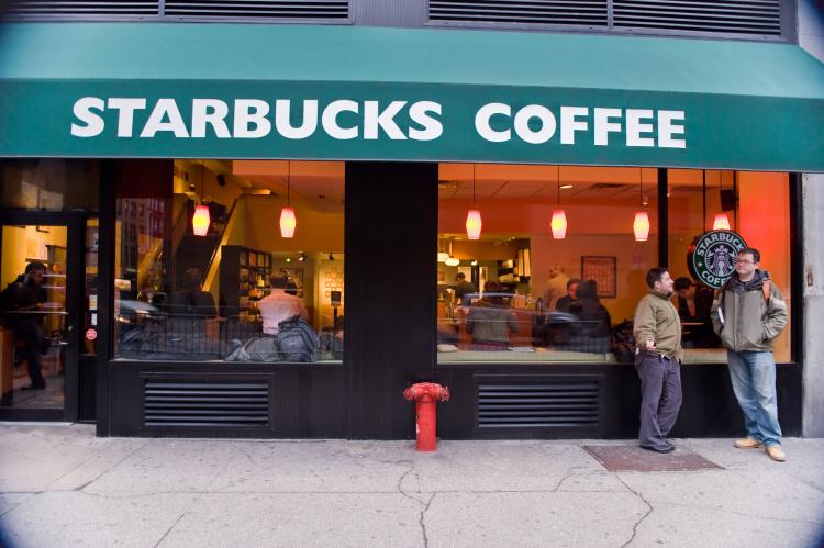 ARMED AND CAFFEINATED: Starbucks will follow local ordinances, some of which allow customers to carry weapons in the stores. (Aloysio Santos/The Epoch Times)