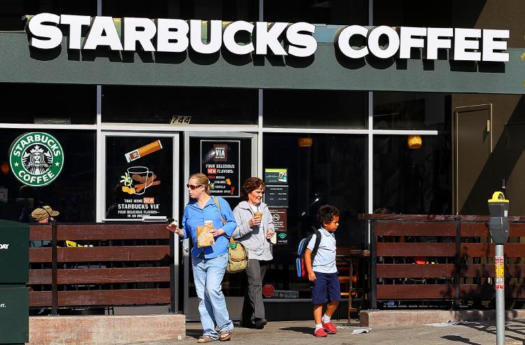 Customers leave a Starbucks Coffee store in San Francisco, California. (Justin Sullivan/Getty Images)