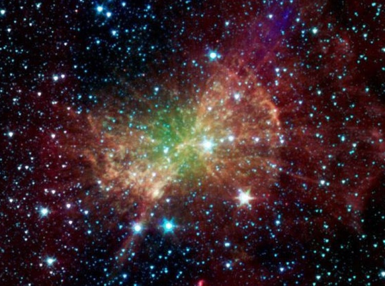 The Dumbbell Nebula, also known as Messier 27, pumps out infrared light in this image from NASA's Spitzer Space Telescope. The nebula was named after its resemblance to a dumbbell when seen in visible light. (NASA/JPL-Caltech/Harvard-Smithsonian CfA)