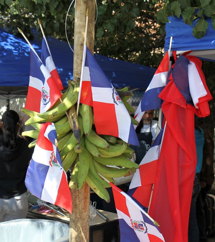 Plantains are shown amid Dominican Republic flags at Primer Festival del Platano, an event that honored the plantain, a dietary staple for many Caribbean and African cultures. (Zack Stieber/The Epoch Times)