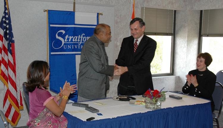 Dr. Richard R. Shurtz, II and Mr. K. K. Modi shake hands at Stratford University's main campus in Falls Church, Virginia on Oct. 1. (Courtesy of Stratford University)