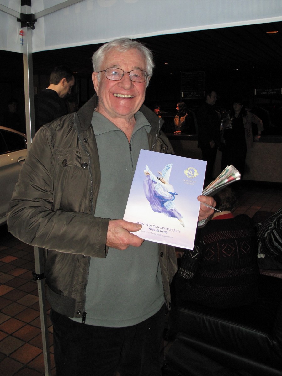 Tom Sutherland poses for a photo with the Shen Yun
