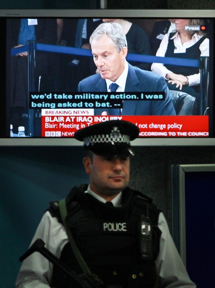 TESTIMONY: Former U.K. Prime Minister Tony Blair is seen on a television screen during The Iraq Inquiry on January 21 in London. (Peter Macdiarmid/Getty Images)