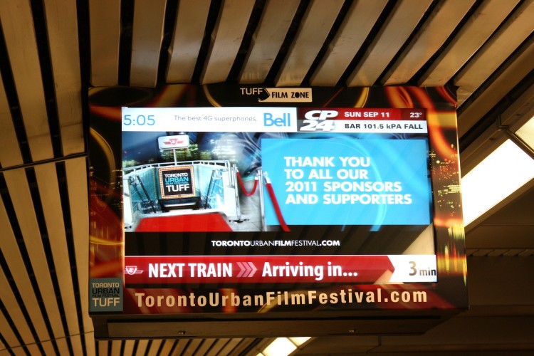 A screen at the Bloor-Yonge subway station displays a thank you ad from the organizers of the Toronto Urban Film Festival which runs Sept. 9-18.  (Jeffrey Thompson/The Epoch Times)