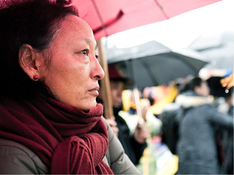 A SAD DAY: A Tibetan woman attends a rally in New York City on March 10, to mark the 52-year anniversary of the Tibetan uprising. The same day, the Dalai Lama announced he was stepping away from all political duties in favor of an elected Tibetan government-in-exile. (Amal Chen/The Epoch Times)