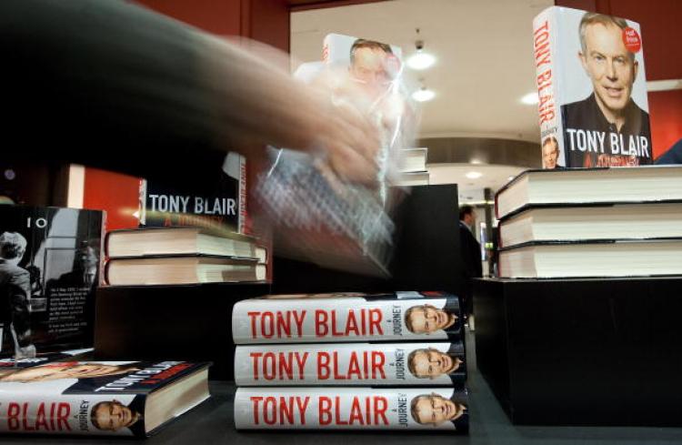 A man takes a copy of former British Prime Minister Tony Blair's memoirs, 'A Journey' as it goes on sale at Waterstone's book store in London, on September 1, 2010.  (Leon Neal/AFP/Getty Images)
