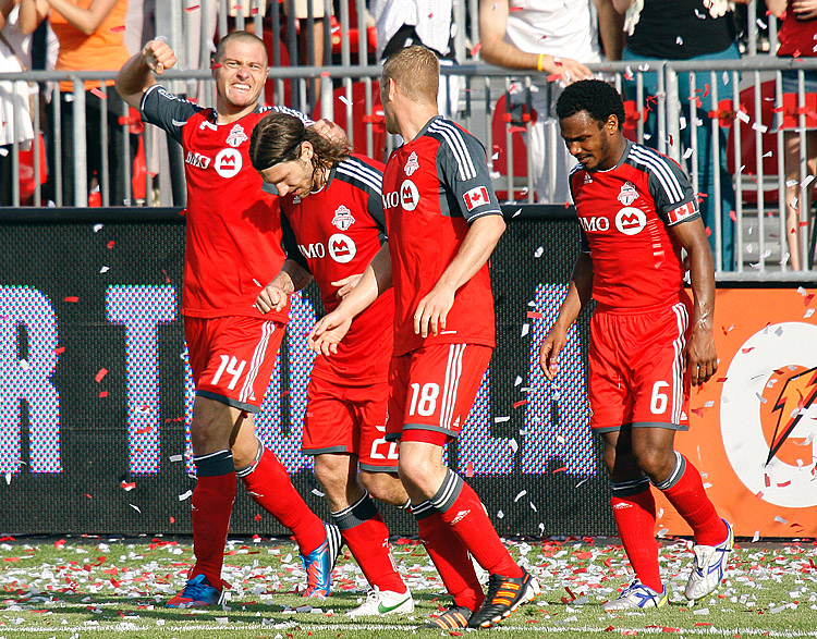 Toronto FC's Danny Koevermans (L) celebrates with his teammates after scoring the game-winning goal against the Philadelphia Union at BMO Field on Saturday. (Abelimages/Getty Images)