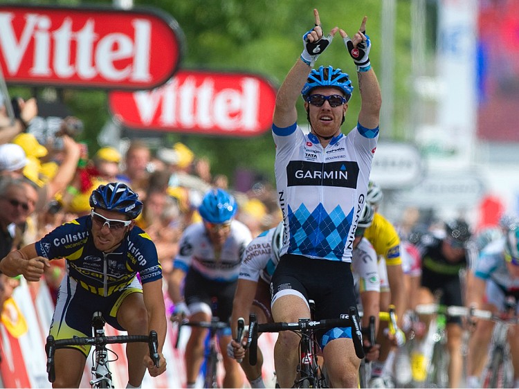 FOR WOUTER: Tyler Farrar holds up the 'W' sign in memory of his fallen friend and fellow rider Wouter Weylandts as he crosses the Finish line first to win Stage Three of the 2011 Tour de France. (Pascal Pavani/AFP/Getty Images)
