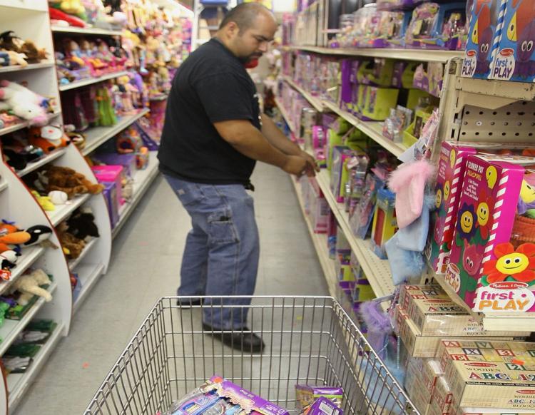 MADE IN CHINA: An employee fills a shopping cart with toys pulled from shelves during Mattel's 2007 recall of 9 million Chinese-made toys. Items made in China continue to top the recall list, including recent recalls of childrens toy jewelry, and househol (Scott Olson/Getty Images)