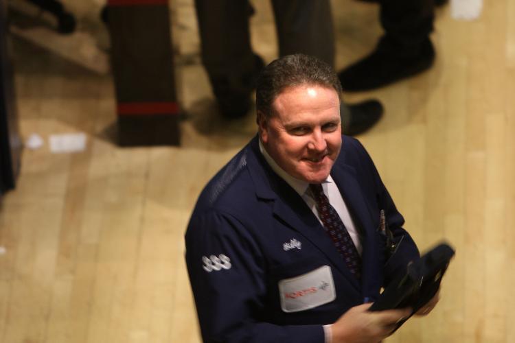 A trader is seen working on the floor of the New York Stock Exchange. Stocks finished in the positive for the fifth straight session on Friday. (Spencer Platt/Getty Images)