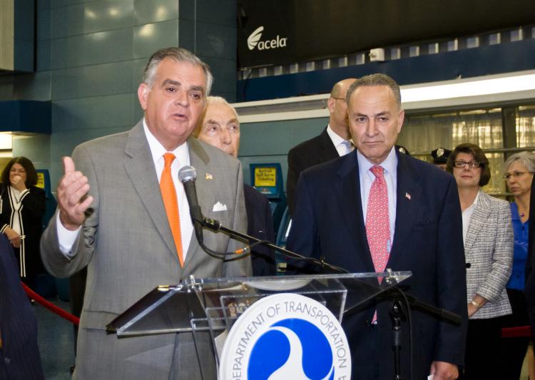 FAST TRACKING: U.S. Secretary of Transportation Raymond LaHood (L) announces the federal government's $2.2 billion investment in transportation infrastructure nationwide. Sen. Charles Schumer (Right, D-N.Y.) stands with him to support the portion of the investment coming to New York. (Phoebe Zheng/The Epoch Times )
