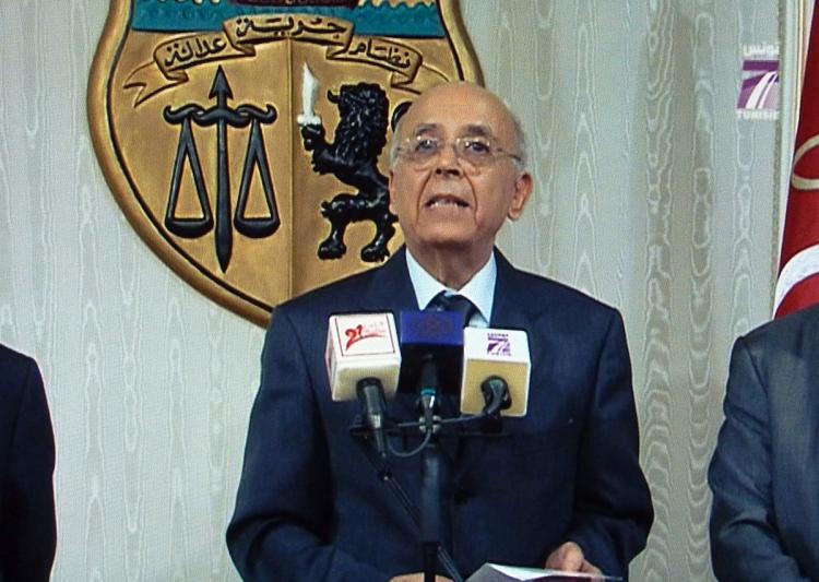TUNISIAN NEW INTERIM LEADER: A photo taken from Channel 7 shows Tunisian Prime Minister Mohammed al-Ghannoushy addressing the nation on state television on Jan. 14. Al-Ghannoushy announced that he had taken over as interim president after Zine El Abidine Ben Ali fled the country.  (Mladen Antonov/Getty Images )