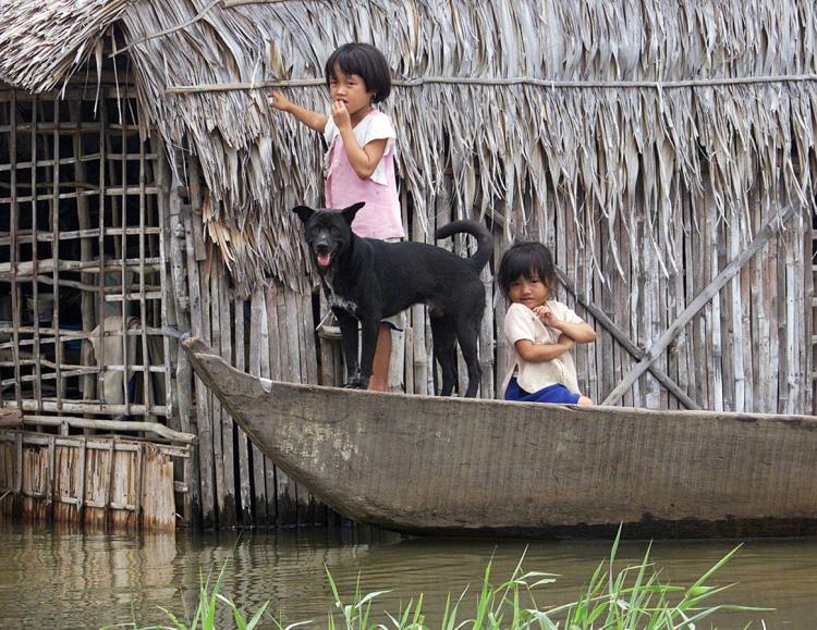 Two young girls take a boat out on their own in Long An Province, in South Vietnam. Every year, up to 350,000 children drown in Asia. The Australian government is funding the establishment of the International Drowning Research Center aimed at reducing ch (Hoang Dinh Nam/AFP/Getty Images)