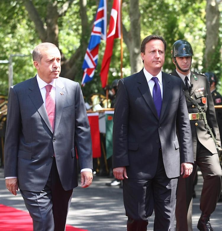 British Prime Minister David Cameron (R) walks with Turkish Prime Minister Recep Tayyip Erdogan (L) outside the Turkish PM's office in Ankara, on July 27. Cameron pledged to remain Turkey's 'strongest possible advocate for EU membership.'  (Adem Altan/Getty Images)
