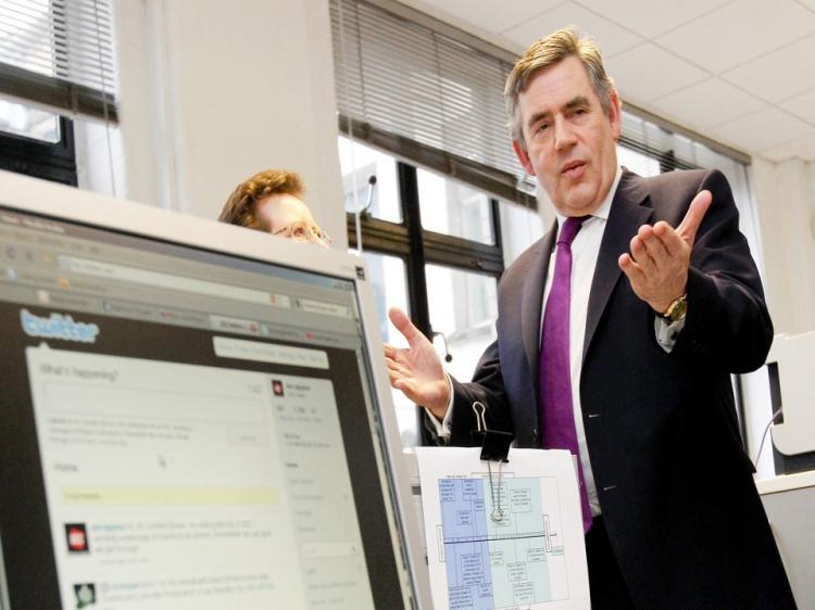 U.K. Prime Minister Gordon Browns stands near a computer logged onto a social networking site. With the first election since the advent of social media, politicians are keen to update strategies to master its vote-winning potential.  (Dan Kitwood/Getty Images)