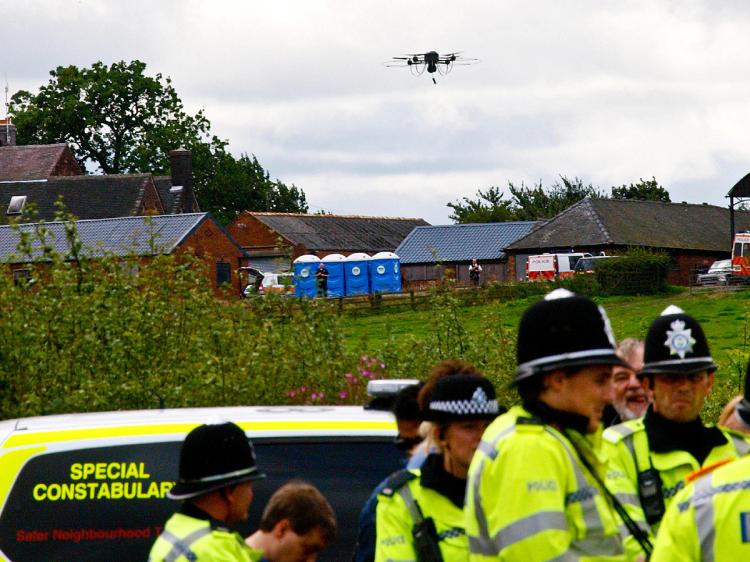 LICENSE TO FLY: A police drone with cameras in action in Codnor Central England. A smaller version of the drone in North West England was grounded earlier this month after authorities realized it had no license to fly. (Max Nash/AFP/Getty Images)