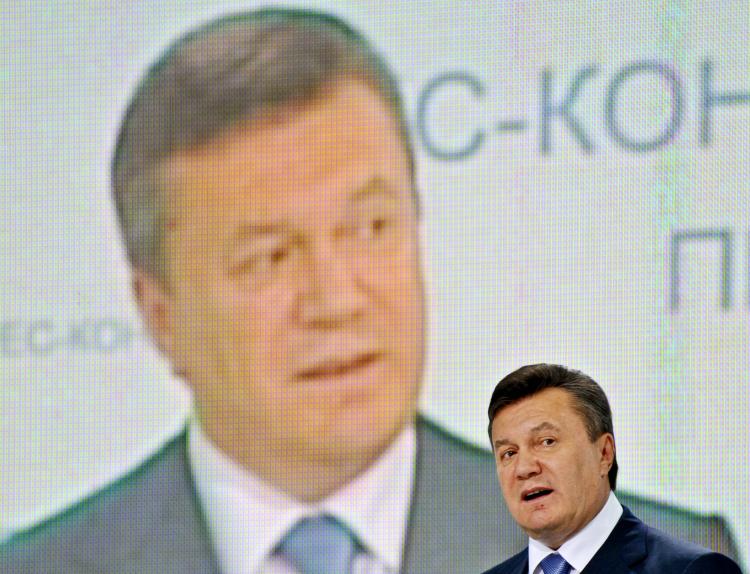 Ukraine President Viktor Yanukovych gestures in front of a screen displaying his image during a press conference devoted to the hundred days of his presidency in Kyiv on June 4. Since he took power last February, censorship, attacks, and harassment of jou (Sergei Supinsky/AFP/Getty Images)