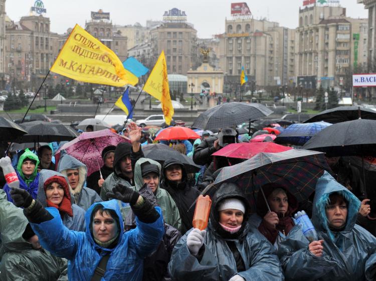 PLEASE LISTEN: Small- and medium-sized business owners rally in Kyiv, on Nov. 23, 2010, against the proposed new unified tax laws, which went into force on Jan. 1. The new rules have increased the tax burden on small businesses forcing many out of business. (Sergei Supinsky/Getty Images)