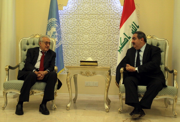 Iraq's Foreign Minister Hoshiyar Zebari (R) welcomes UN Arab League peace envoy for Syria Lakhdar Brahimi (L) as he arrives in Baghdad on October 15, 2012, for talks with Iraqi Prime Minister Nuri al-Maliki over the ongoing conflict in Syria. (Ali Al-Saadi/AFP/GettyImages)