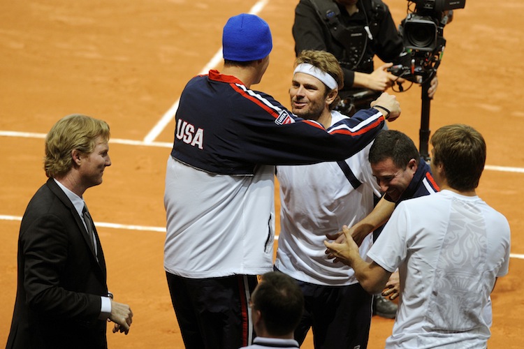 US John Isner congratulates US Mardy Fis