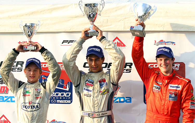 Garrett Grist of Andretti Autosport joins Cape Motorsports' three-time one-two finishers Neil Alberico and Scott Hargrove. (James Fish/The Epoch Times)