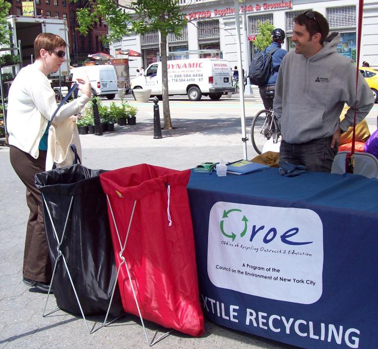 TEXTILE RECYCLING: Donations at the Greenmarket in Union Square, manned by Alex from WearableCollections.  (Jean Harris/Epoch Times Staff)