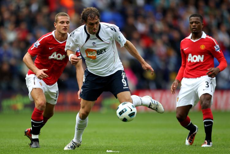 DEFENSIVE ISSUES: Bolton's Johan Elmander gets by Manchester United's porous defense. (Alex Livesey/Getty Images)