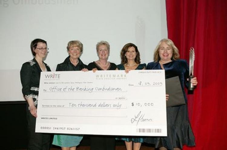 2009 Supreme winners Office of the Banking Ombudsman, with Awards founder Lynda Harris. (Courtesy WriteMark)