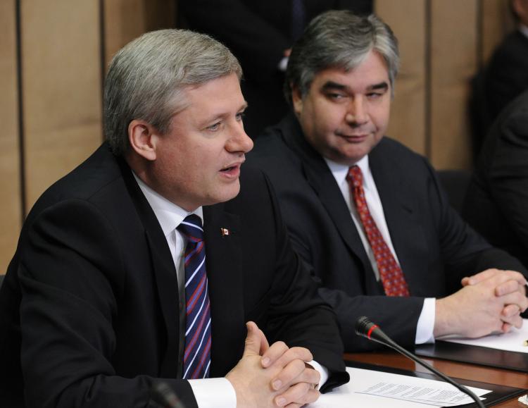 Prime Minister Stephen Harper speaks before an EU-Canada summit meeting at the EU headquarters in Brussels on May 5 while Trade Minister Peter Van Loan looks on. Van Loan says the proposed Canada-EU Comprehensive Economic and Trade Agreement will give Can (John Thys/AFP/Getty Images)