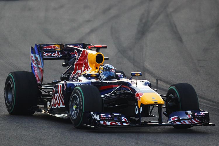 FORMULA ONE GOING GREEN: Formula One World Champion Sebastian Vettel drives during the 2010 Abu Dhabi Formula One Grand Prix. Starting in 2013, his engine will have half as many cylinders. (Paul Gilham/Getty Images)