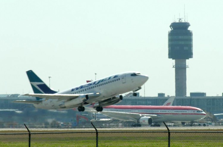 An airplane takes off from the Vancouver International Airport.