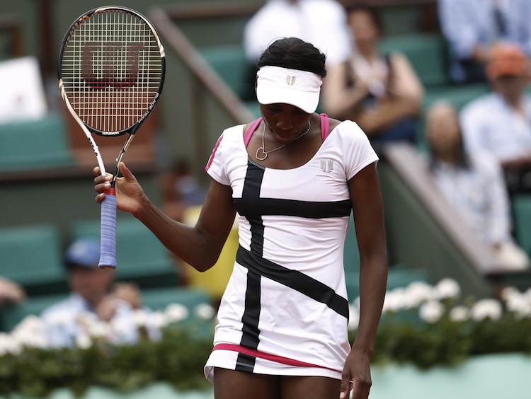 US Venus Williams reacts after a point a