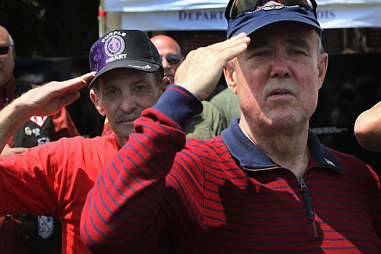 MEN WHO SERVED: Vietnam veterans attend the opening ceremony for Welcome Home 2011 at Navy Pier in Chicago June 17. Veterans groups are reaching out to today's young veterans to avoid the mistakes made in the treatment of Vietnam veterans as they returned from war. (Scott Olson/Getty Images)