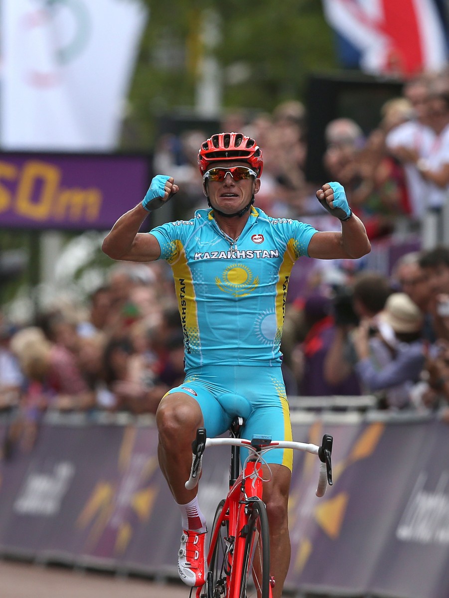Alexandr Vinokurov of Kazakhstan celebrates crossing the finish line to win the men's cycling road race on Day 1 of the London 2012 Olympic Games. (Ezra Shaw/Getty Images)
