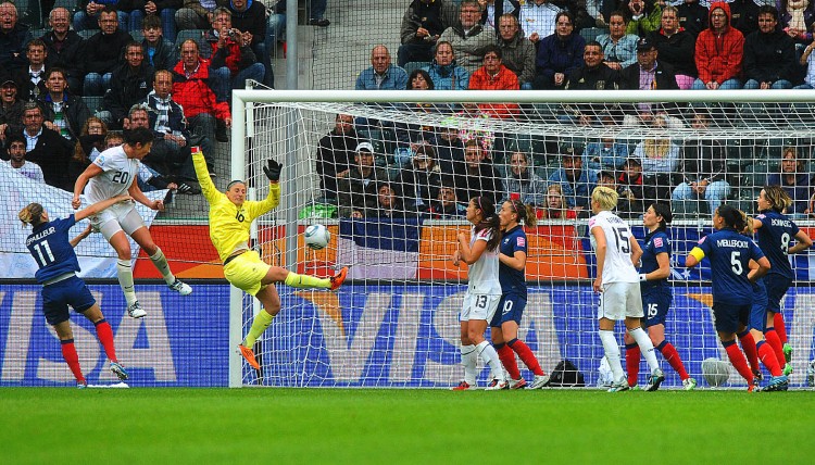 WINNER: Abby Wambach (2ndL) scores the game-winning goal past France's goalkeeper Berangere Sapowicz (3rdL) and France's defender Laure Lepailleur during their FIFA women's World Cup semi-final match. (Christof Stache/AFP/Getty Images)