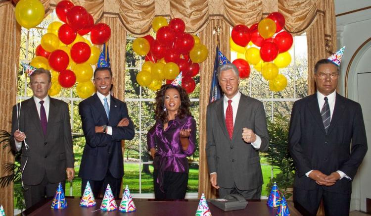 Wax figures [left to right] George W. Bush, Barack Obama, Oprah, Bill Clinton, and Colin Powell were gathered together in Madam Tussaud's Oval Office exhibit to celebrate President Obamaâ��s 41st birthday. (Cliff Jia/The Epoch Times)