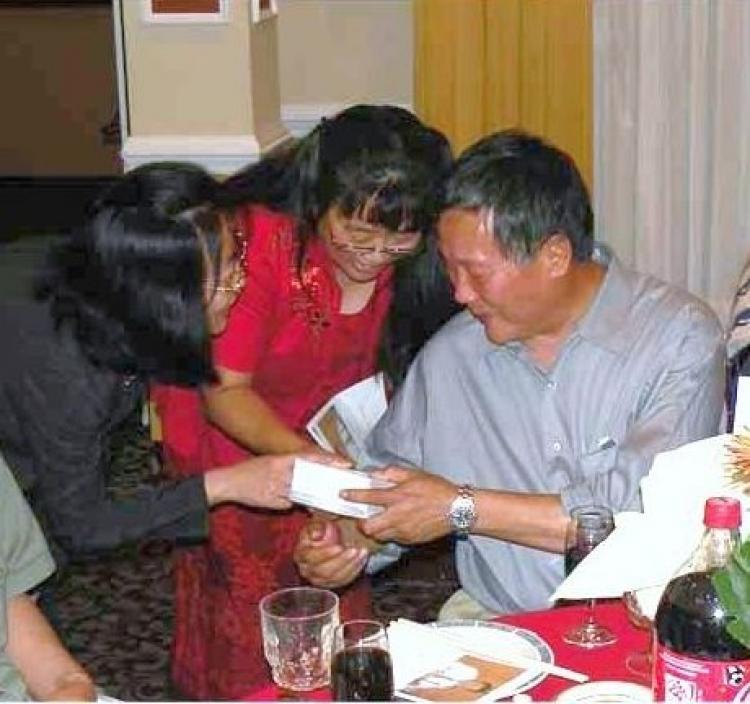 Wei Jingsheng (right), a leading China democracy advocate, is celebrated on his 60th birthday by friends and well-wishers. The celebration was at a Washington, D.C. suburb, May 22. (Wei Jingsheng Foundation)