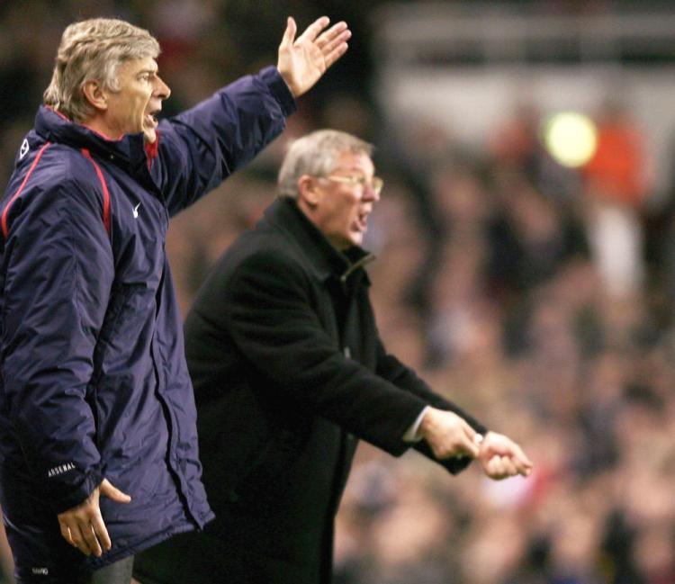 Arsene Wenger (L) and Sir Alex Ferguson are anomalies in the English Premier League, given the their long tenure with their respective clubs. (Ben Radford/Getty Images)